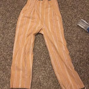 Peach or tan striped pants